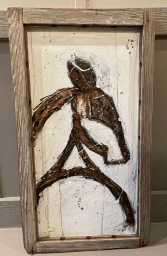 Artistic depiction of a horse in a rustic wooden frame.