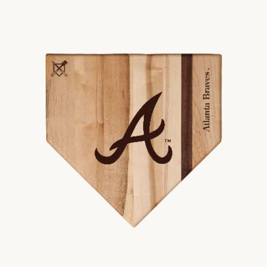 Wooden home plate with Atlanta Braves A logo on a white background