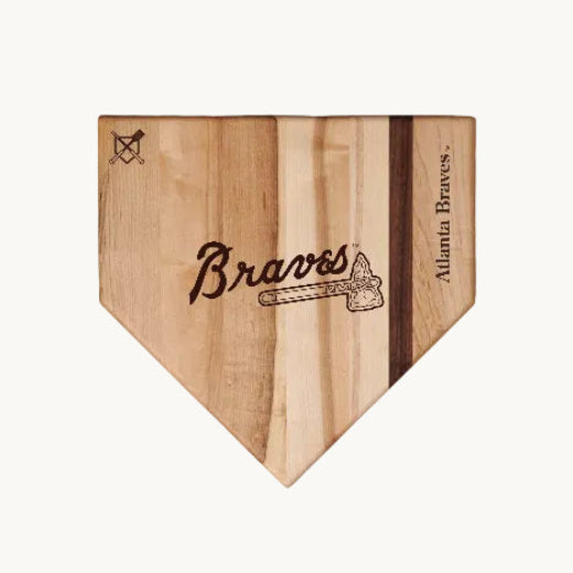 Wooden home plate with Atlanta Braves A logo on a white background
