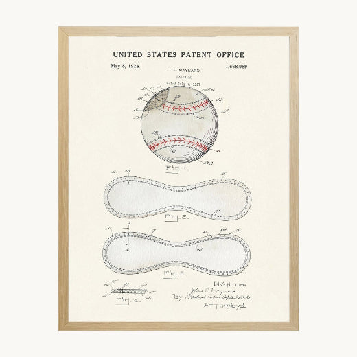 1928 U.S. Patent Office baseball drawing on aged cream parchment with red stitch detail, professionally framed in natural wood. The Red Hound Gifts.