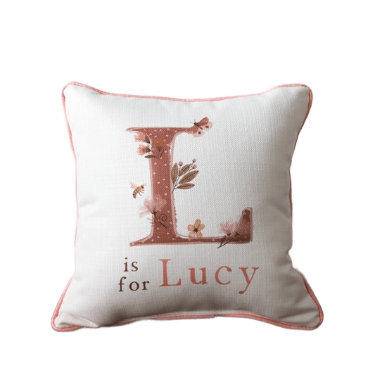Decorative pillow with 'L is for Lucy' text on a  off white background