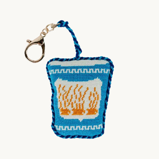 Needlepoint iced coffee cup bag charm in light blue with blue rope trim and gold tone clasp