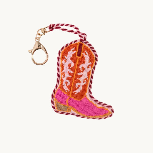Needlepoint cowboy boot bag charm in pink and orange with red and white rope trim and gold tone clasp