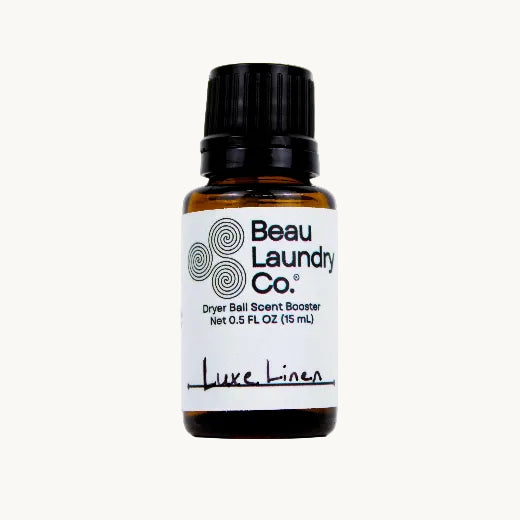 Dryer ball scent booster bottle on a white background