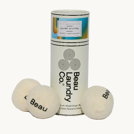 Azure scented wool dryer balls with packaging on a white background