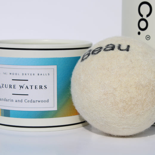 Azure scented wool dryer balls with packaging on a white background