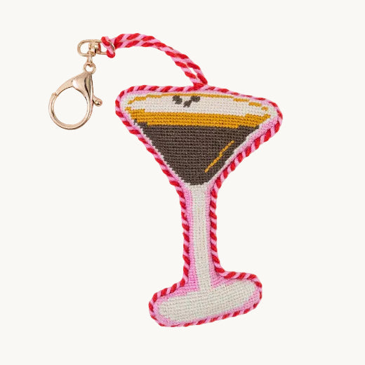 Espresso Martini needlepoint bag charm with pink braided edge and gold tone lobster clasp — cocktail-inspired bag accessory