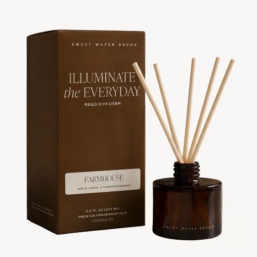Farmhouse reed diffuser in amber glass jar with coordinating gift box and natural rattan reeds. The Red Hound Gifts.