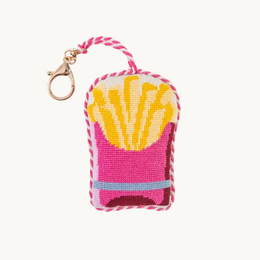 Needlepoint french fries bag charm in bright pink and yellow with pink and white rope trim and gold tone clasp