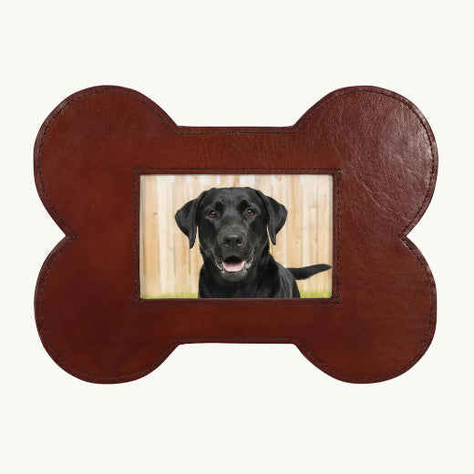 Brown leather bone-shaped 4x6 picture frame shown with a black Labrador photo. 