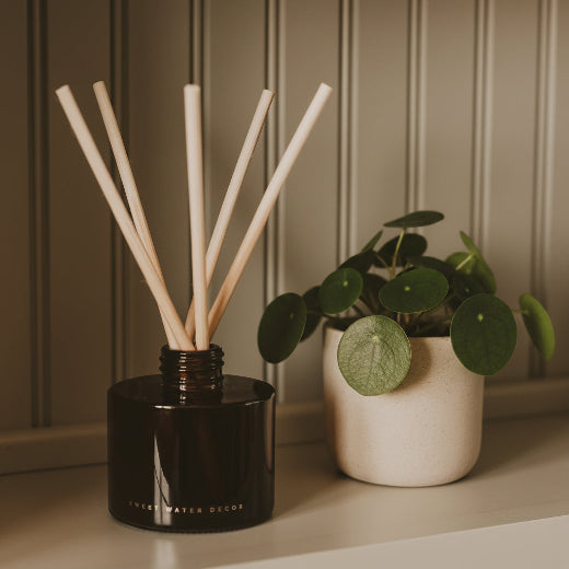 Hello Fall reed diffuser in amber glass jar with dark brown gift box and natural rattan reeds. The Red Hound Gifts.