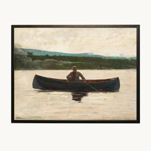 A framed painting depicting a person rowing in a dark canoe on a calm lake, with distant hills and a light sky. 
