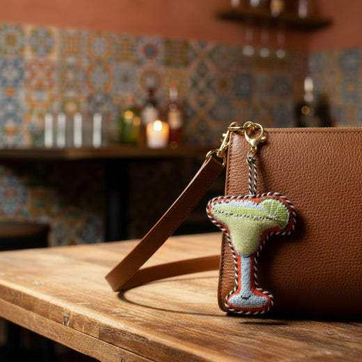 Needlepoint keychain shaped like a margarita glass with lime wedge with a gold tone lobster clasp