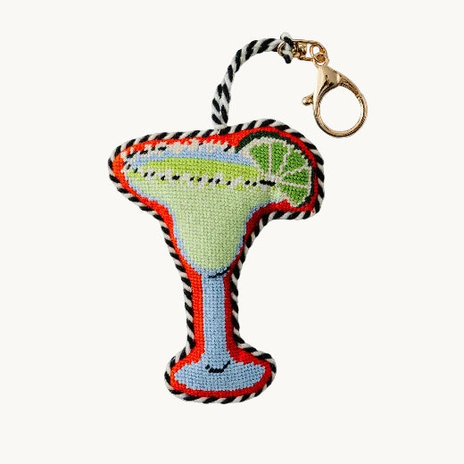Needlepoint keychain shaped like a margarita glass with lime wedge with a gold tone lobster clasp
