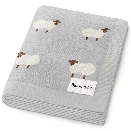 Meadow Sheep baby blanket in Natural  — soft luxury cotton knit with charming sheep motif, folded flat
