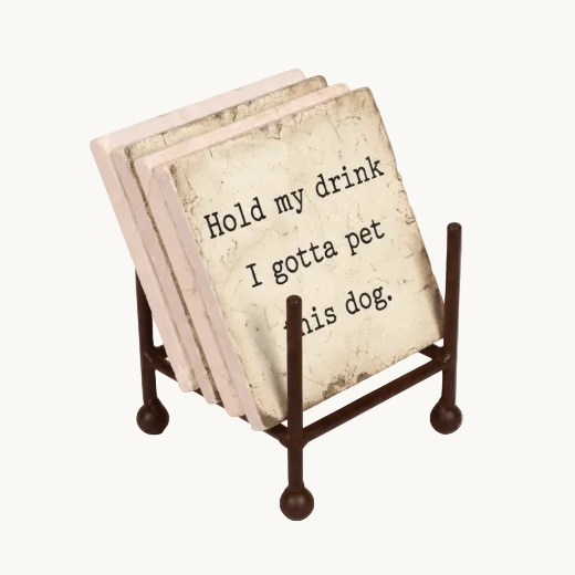 Set of coasters nestled in a a metal coaster stand