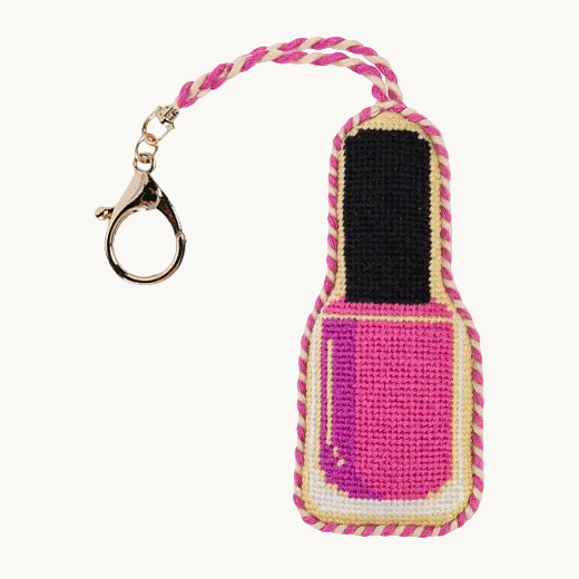 Needlepoint nail polish bottle bag charm in hot pink with gold and pink rope trim with a gold tone clasp