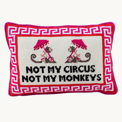 Not My Circus Not My Monkeys needlepoint pillow styled on a cream chair