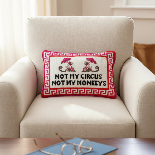 Not My Circus Not My Monkeys needlepoint pillow styled on a cream chair