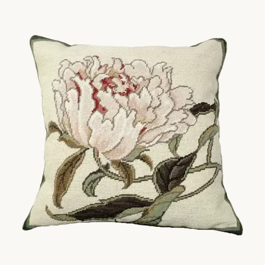 Peonies Needlepoint Pillow displayed  on a window seat