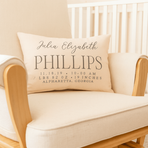 Beige pillow with personalized text on a beige armchair