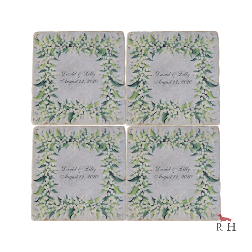 Four square coasters with floral designs and personalized text 