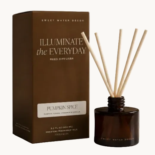 Pumpkin Spice reed diffuser in amber glass jar with dark brown gift box and natural rattan reeds. The Red Hound Gifts.