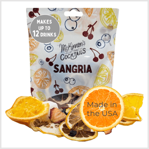Mason jar with sangria ingredients and a label on a white background