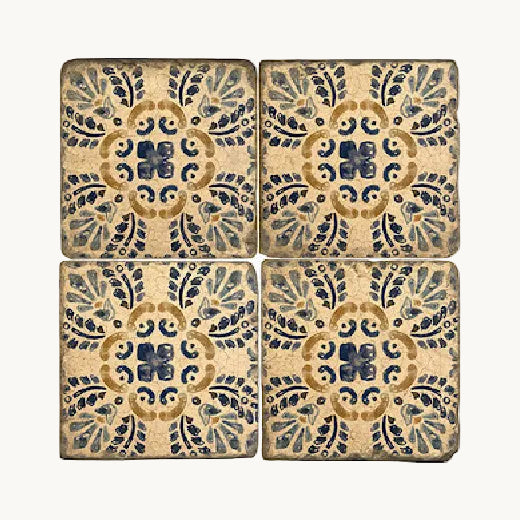 Set of four Talavera pattern Italian tumbled marble coasters arranged in a grid. The Red Hound Gifts.