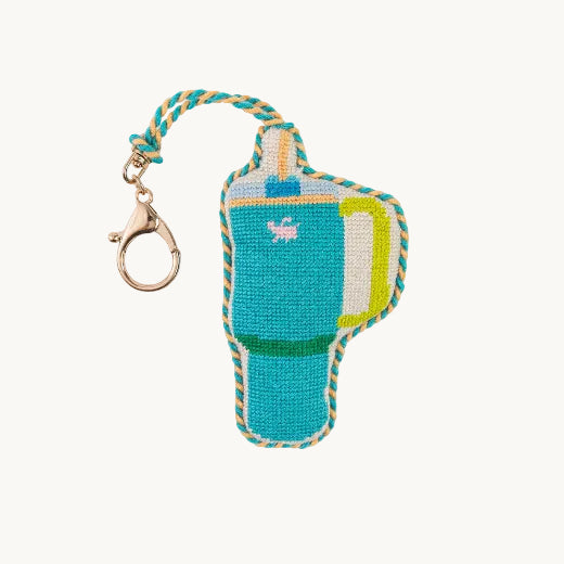 Needlepoint tumbler mug bag charm in teal and yellow with teal and white rope trim and gold tone clasp