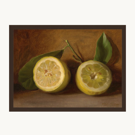 Framed vintage style oil painting reproduction of two sliced lemons with leaves against a rich, dark amber background in a classic thin gold frame.