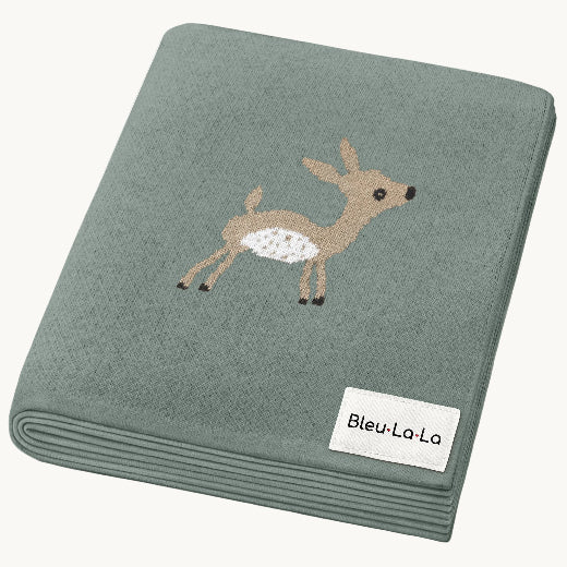 Woodland Deer baby blanket in Meadow Sage — soft luxury cotton knit with baby deer motif, folded flat