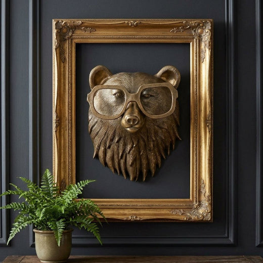 Antique brass finished bear bust wall mount with textured ruff and oversized spectacles.