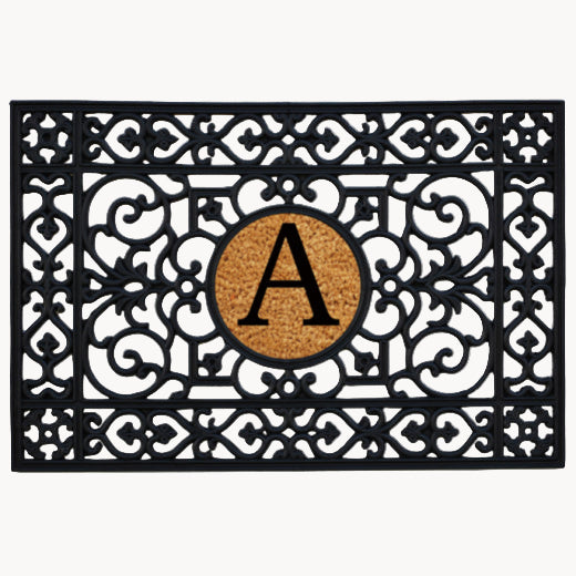 A black natural rubber mat with a decorative pattern and a center 9" coir insert